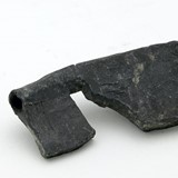 Gesneden loden sleutel, vermoedelijk halffabrikaat, na 1525 - voor 1600. © Slot Loevestein, publiek domein.