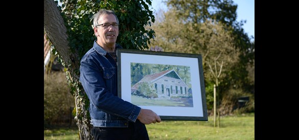 Jan Roerdink met schilderij.