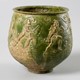 Groen geglazuurde gladiatorenbeker 2e eeuw n.Chr. uit Nijmegen-west. © Collectie Valkhof Museum, bruikleen RCE, publiek domein.