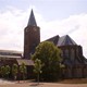 Seminarie Apeldoorn, met gecombineerde klokken en watertoren © PD